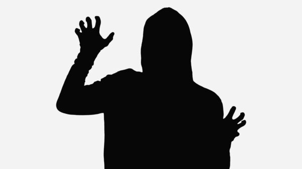 black silhouette of zombie man showing scaring gesture isolated on white