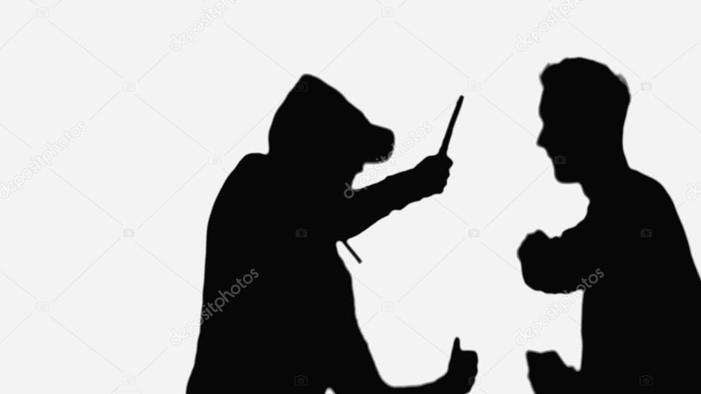 black silhouettes of robber with knife and man with clenched fists isolated on white