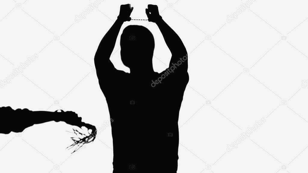 black silhouette of man in handcuffs near woman with flogging whip isolated on white