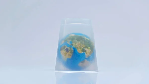 Globe covered with plastic cup on grey — Stock Photo