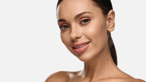 Portrait of brunette young woman smiling and looking at camera isolated on white — Stock Photo