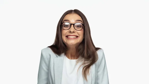 Overjoyed businesswoman in grey blazer and eyeglasses smiling isolated on white — Stockfoto