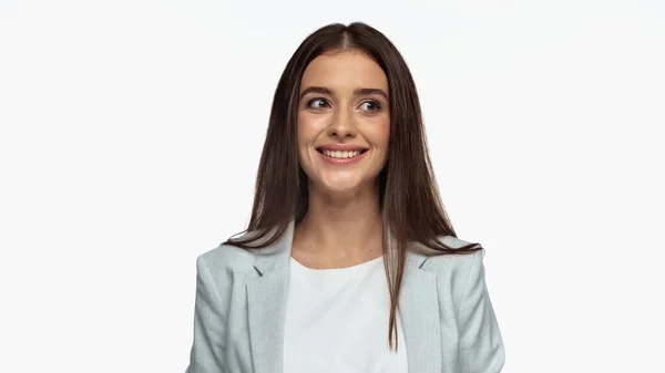 Happy businesswoman in grey blazer looking away and smiling isolated on white — Stock Photo