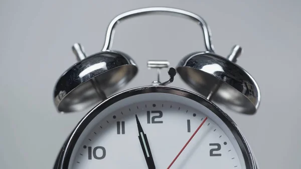 Shiny and metallic vintage alarm clock isolated on grey — Stock Photo