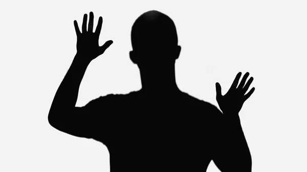 Black silhouette of man waving hands isolated on white — стоковое фото