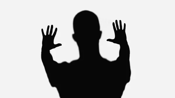Black silhouette of man showing stop gesture isolated on white — Foto stock