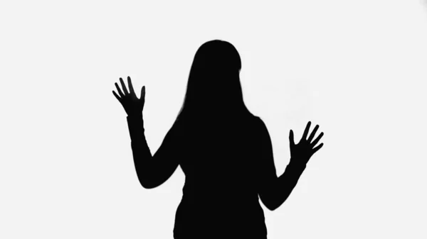 Black shadow of woman waving hands isolated on white — стоковое фото