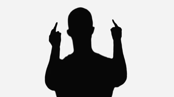 Silhouette of rude man showing middle fingers isolated on white — Stock Photo