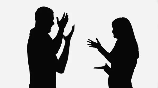 Shadows of husband and wife quarreling and gesturing isolated on white - foto de stock
