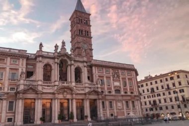 Time-lapse of red sunset clouds over the marvelous facade of the Basilica of Santa Maria Maggiore in Rome, Italy.