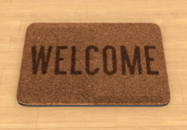 Welcome mat ahşap zemin üzerinde