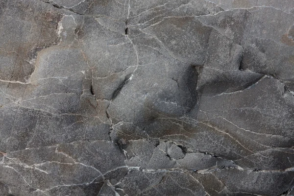 Gray smooth stone with cracks and veins — Stock Photo, Image