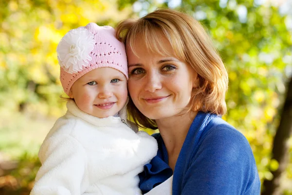 Happy little girl with her mother — Stock Photo, Image