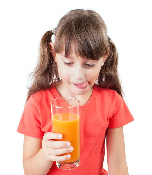 Klein meisje houdt van een glas sap — Stockfoto