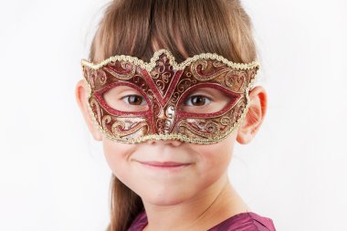 Charming girl in a carnival mask clipart