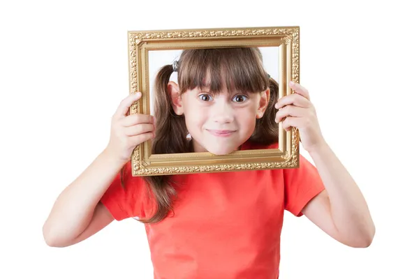 Meisje op zoek uit afbeeldingsframes — Stockfoto