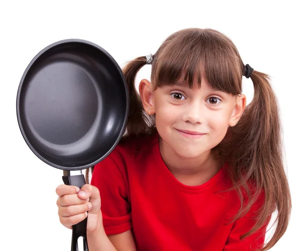 Klein meisje houden een koekenpan — Stockfoto