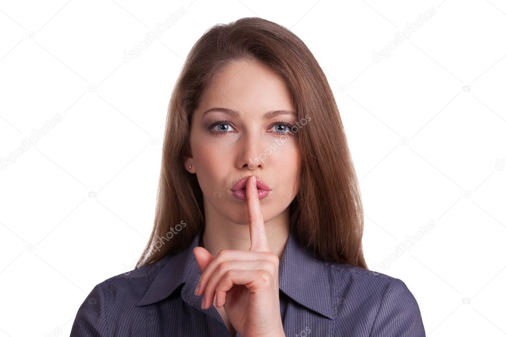 Woman calls for silence, finger on lips