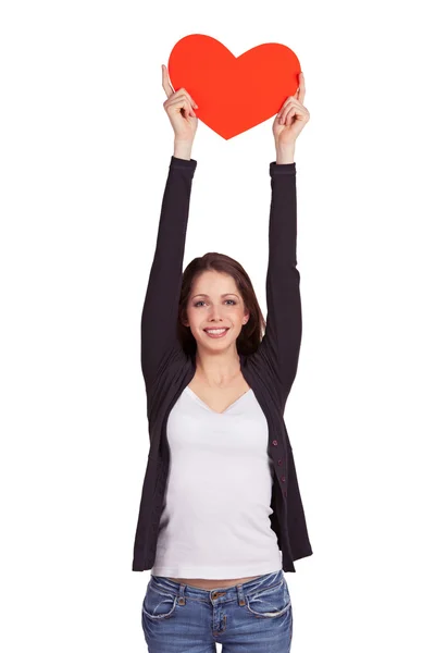 Veselá černovlasá dívka drží srdce přes hlavu — Stock fotografie