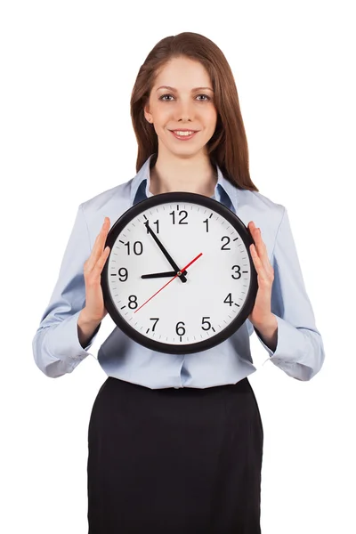 Ung kvinna med en rund klocka — Stockfoto