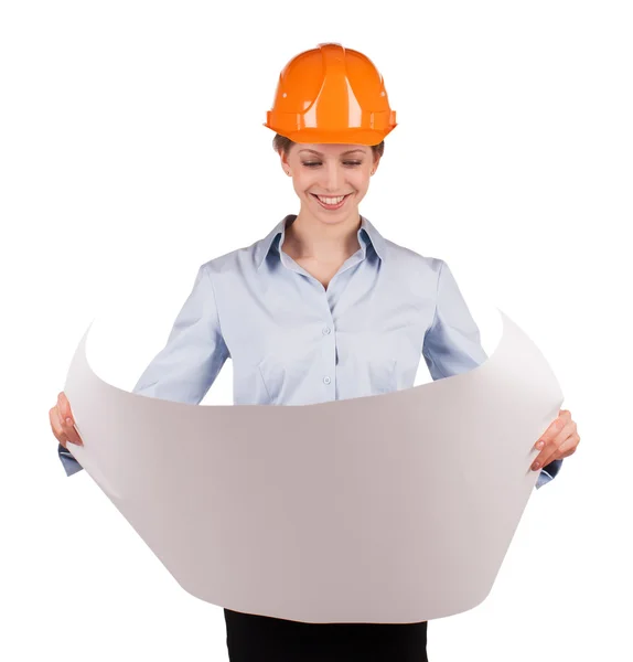 Woman in an protective helmet looks drawing — Stock Photo, Image