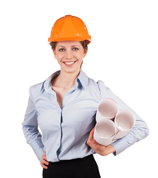 Femme dans un casque avec des plans de construction — Photo