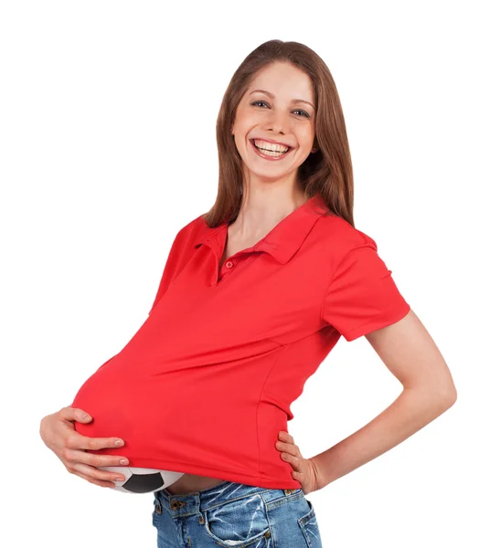 Девушка с мячом показывает беременность — стоковое фото