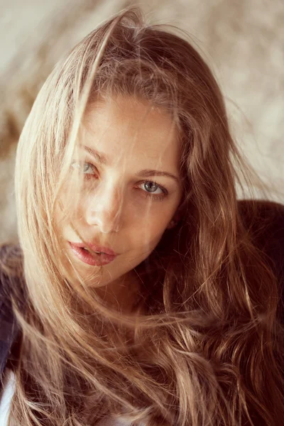 Beautiful woman with developing hair in the wind — Stock Photo, Image