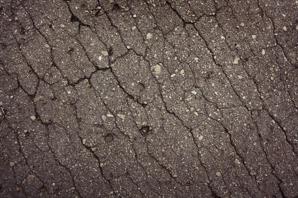 Asphalt with numerous small cracks — Stock Photo, Image