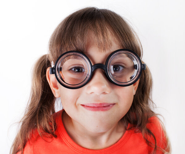 Funny little girl in round glasses