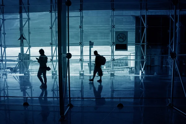 People walk down the hall airport