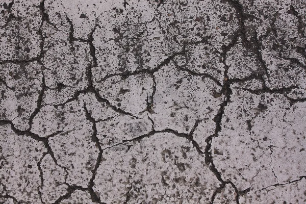 Asphalt road with many cracks — Stock Photo, Image