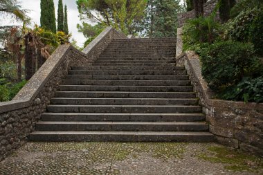 Old stone stairs in the park clipart