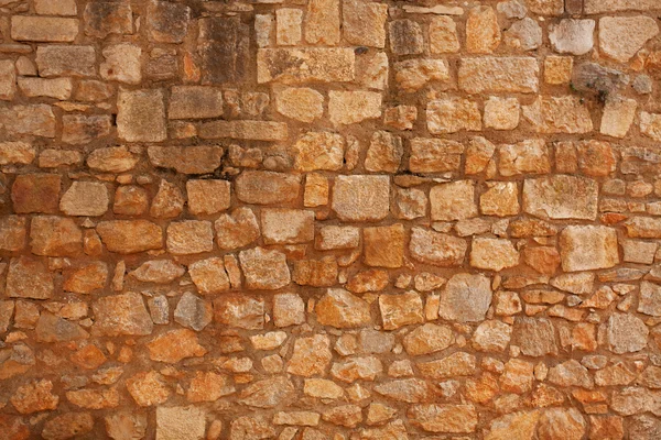 Vecchio muro di mattoni di pietra grezza — Foto Stock