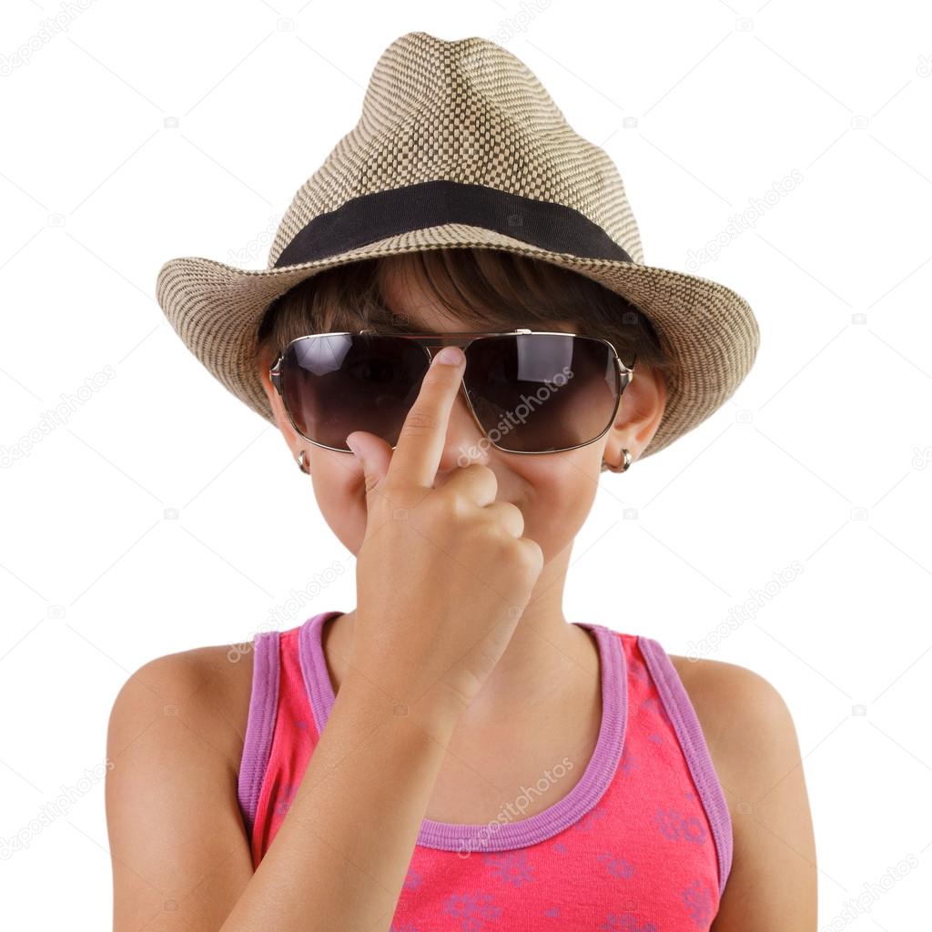 Little girl in a straw hat and sunglasses