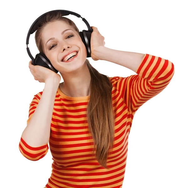 Cheerful girl with headphones listening to music Stock Picture