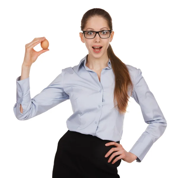 Surprised girl with chicken egg on a white background — Stock Photo, Image