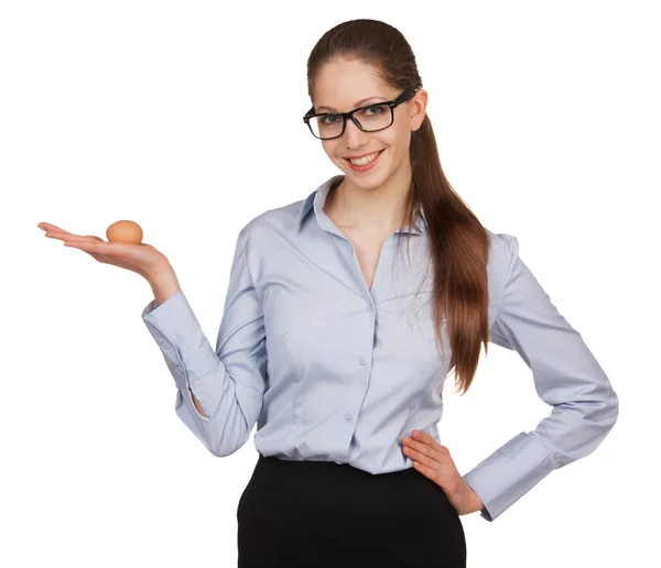 Cheerful woman holding a chicken egg — Stock Photo, Image