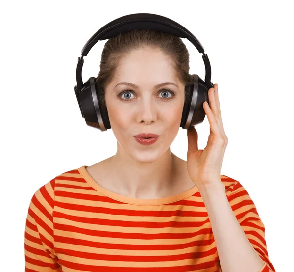 Cheerful girl listening to music on headphones — Stock Photo, Image