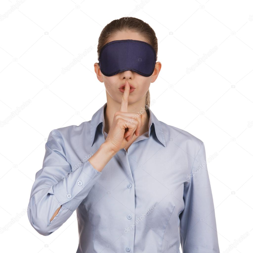 Young woman blindfolded calls for silence