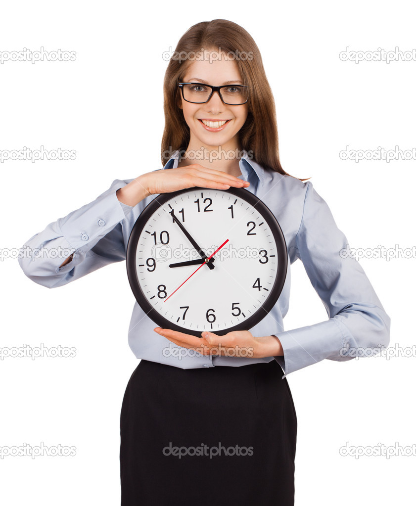 Smiling young woman holding a clock