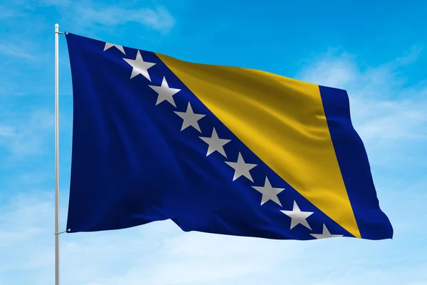 ボスニア ヘルツェゴビナの旗が青空になびく — ストック写真