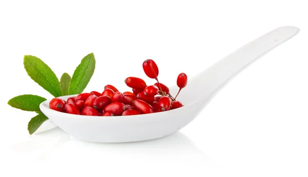 Barberries in spoon with green leaf — Stock Photo, Image