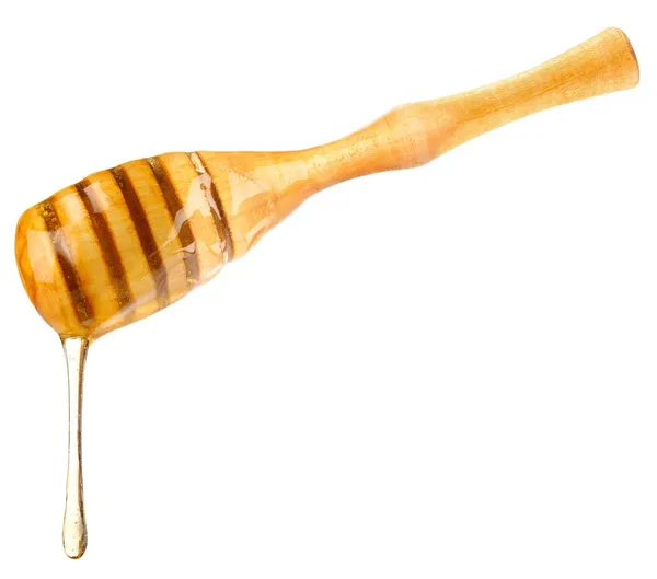 Μέλι πτώση σχετικά με ξύλινη κουτάλα — Φωτογραφία Αρχείου