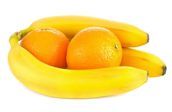 Fresh ripe bananas and orange fruits — Stock Photo, Image