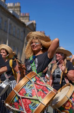 Bath, England, United Kingdom - 9 July 2022: Drumming band performing at the annual carnival as it progresses through the streets of the historic city of Bath in Somerset.