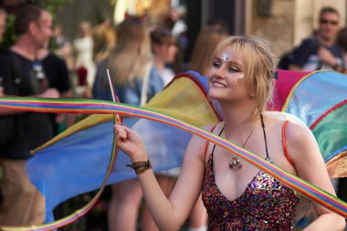 Bath, England, United Kingdom - 9 July 2022: Dancers in ornate costumes performing at the annual carnival as it progresses through the streets of the historic city of Bath in Somerset.