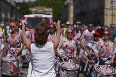 Bath, England, United Kingdom - 9 July 2022: Drumming band performing at the annual carnival in the historic city of Bath in Somerset.