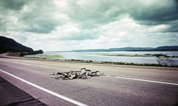 Dollar bills on a highway — Stock Photo, Image