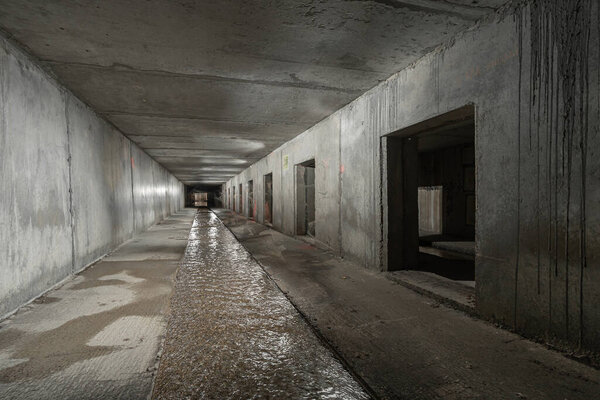 Interior of rectangular concrete tunnel of a drainage collector.